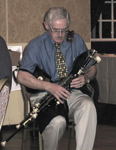 11_09_dinnerentertainment.jpg - Dave Hegarty with his Uillean Pipes (September 2008 Issue)