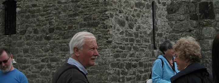 DGSMembersoutsideRuins.jpg - Paddy Dalton and other DGS members look at the ruins (CN)
